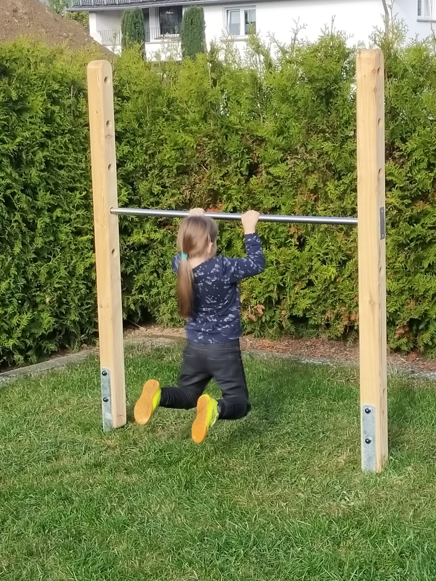 Girl on the gymnastics bar